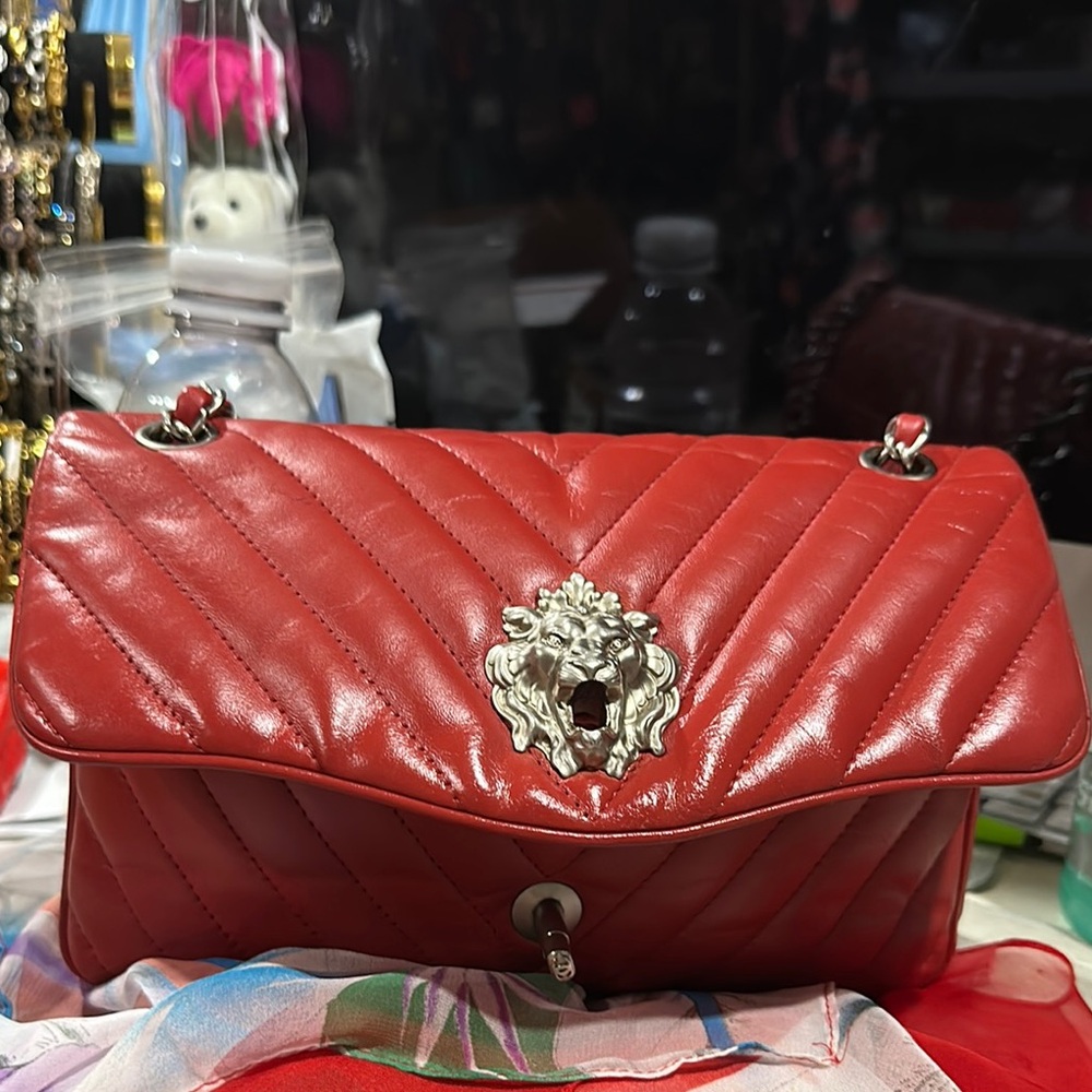 CHANEL Red Quilted Shoulder Bag with Silver Embellishment